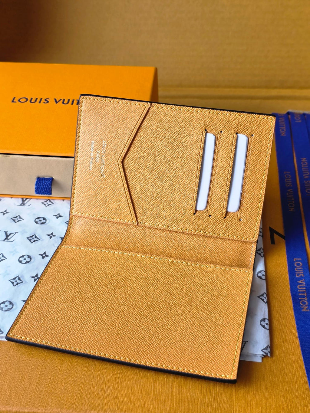 Beige small bag with card slots and snap closure, interior open