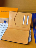 Beige small bag with card slots and snap closure, interior open