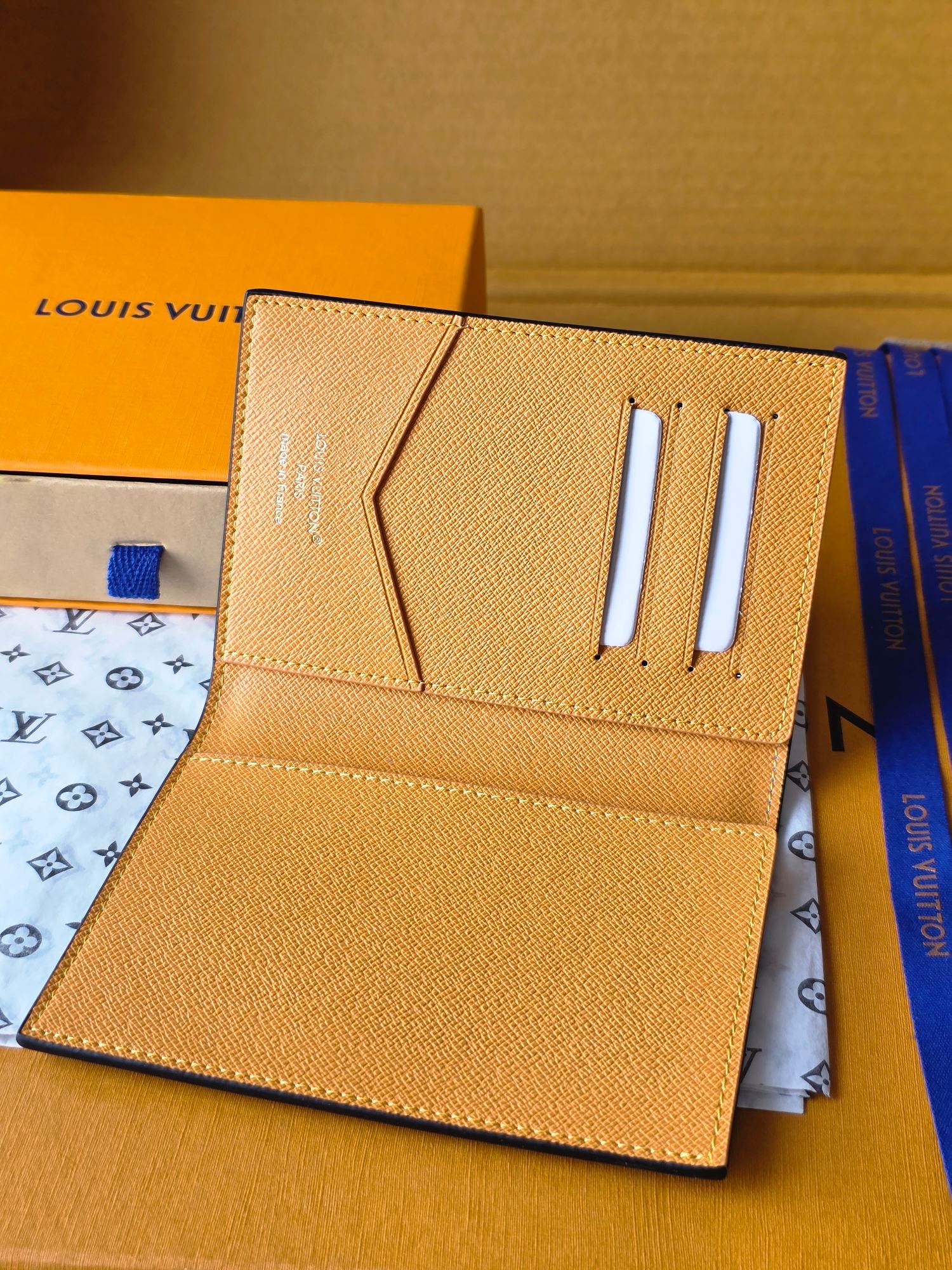 Beige small bag with card slots and snap closure, interior open