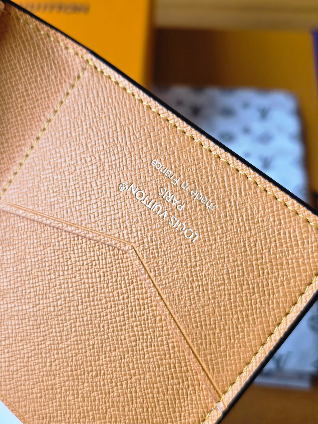 Beige small bag lining with printed text and diagonal seam