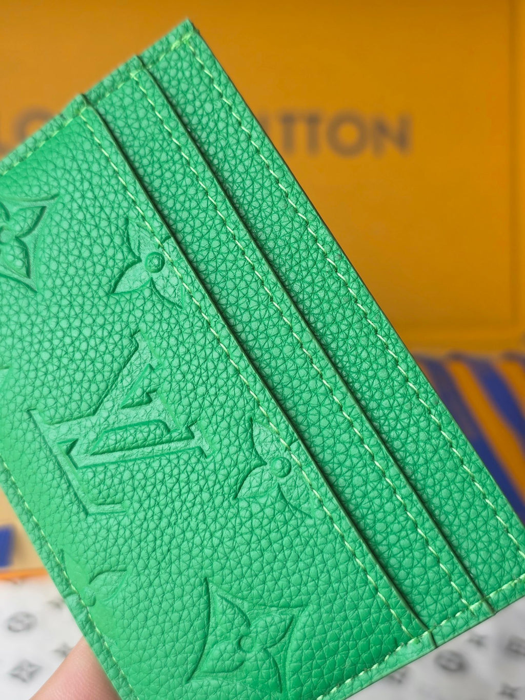 Louis Vuitton green embossed mini bag with lined interior panel and textured grain