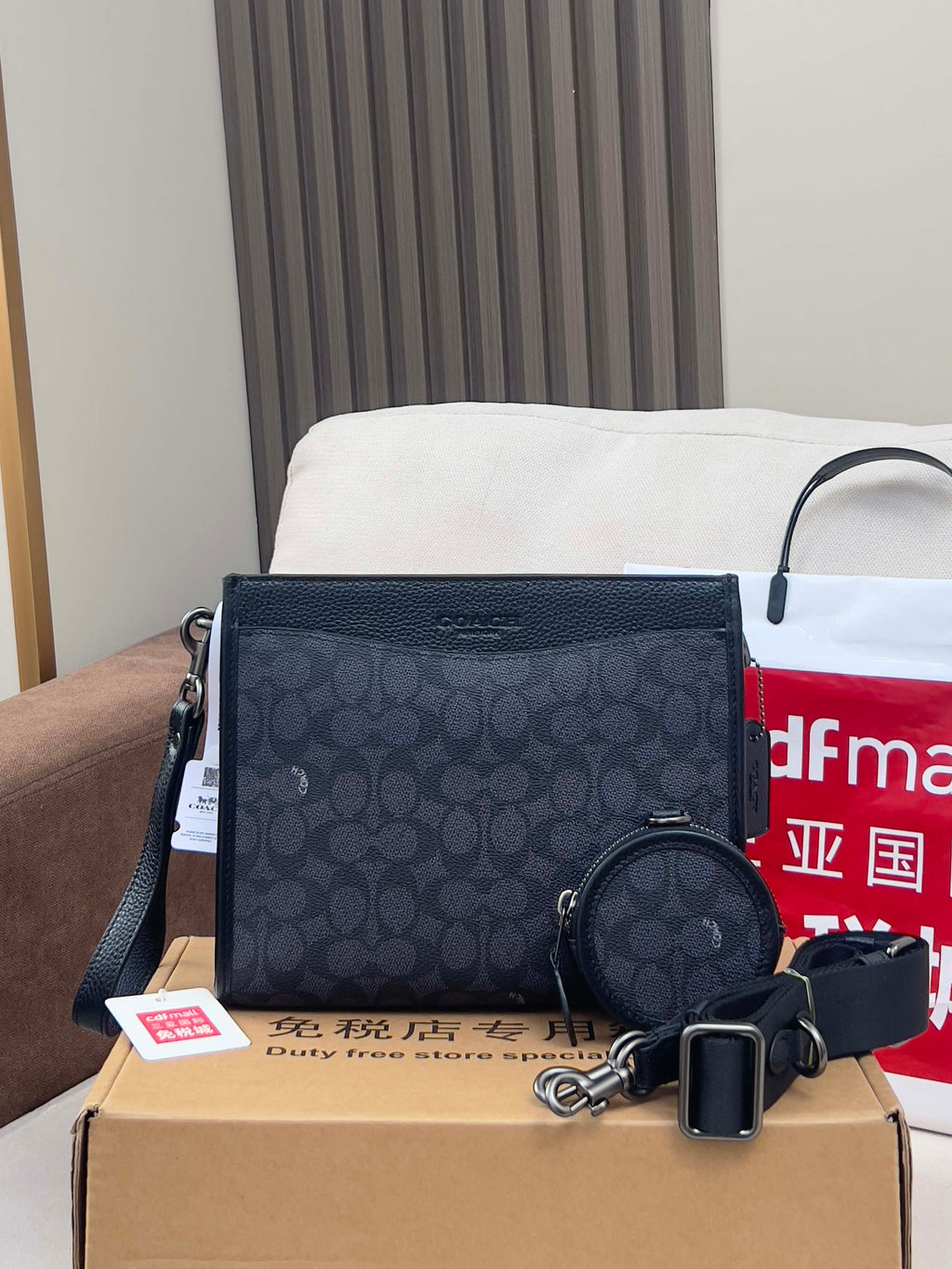 Dark navy patterned handbag with zip top, plus round zip pouch and keychain