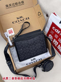 Dark navy patterned crossbody bag with zip top and adjustable shoulder strap