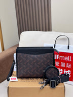 Dark monogram crossbody bag with zip top and round keychain charm