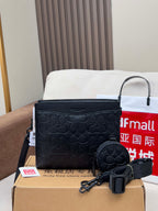 Black COACH crossbody bag with zip top and matching round coin pouch
