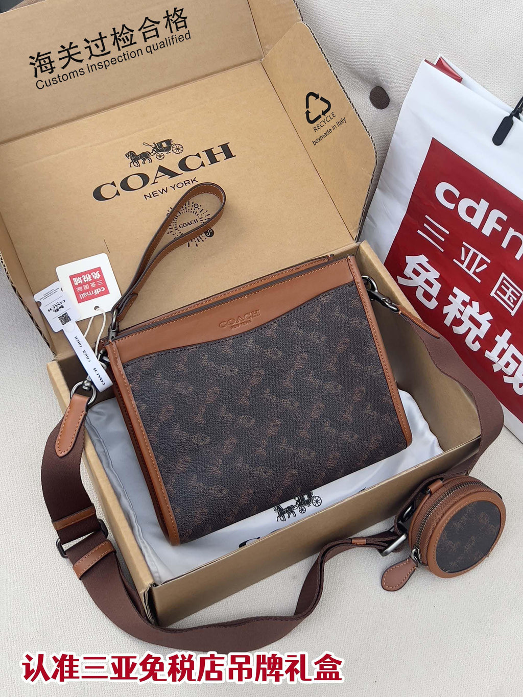 Coah bag in dark monogram canvas with brown leather trim and adjustable strap
