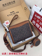 Coah bag in dark monogram canvas with brown leather trim and adjustable strap