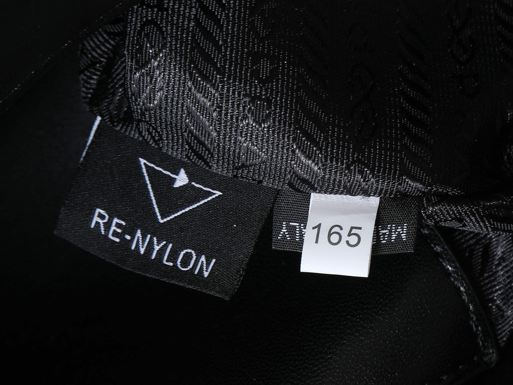 Black fabric interior label reading RE-NYLON, with size/lot marking 165
