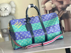 Louis Vuitton duffel bag with blue and turquoise monogram, dark handles and strap