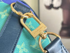 Louis Vuitton bag hardware with gold-tone clasp on blue leather strap