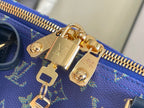 Louis Vuitton duffel bag zipper and gold-tone hardware on blue monogram canvas