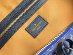 Louis Vuitton logo patch on interior lining with blue leather trim and gold zipper