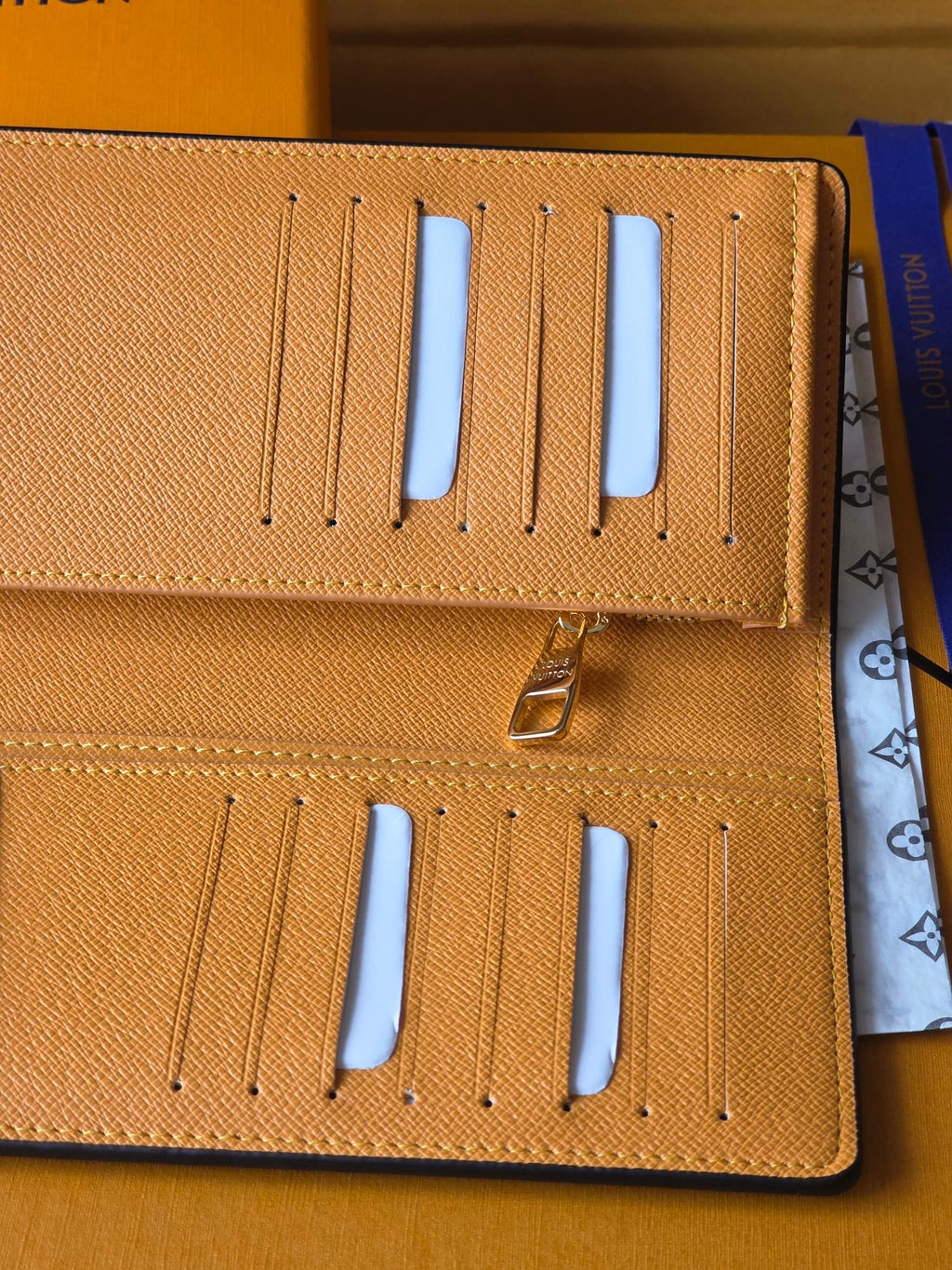 Small card holder interior with 6 card slots, blue insert tabs, gold hardware