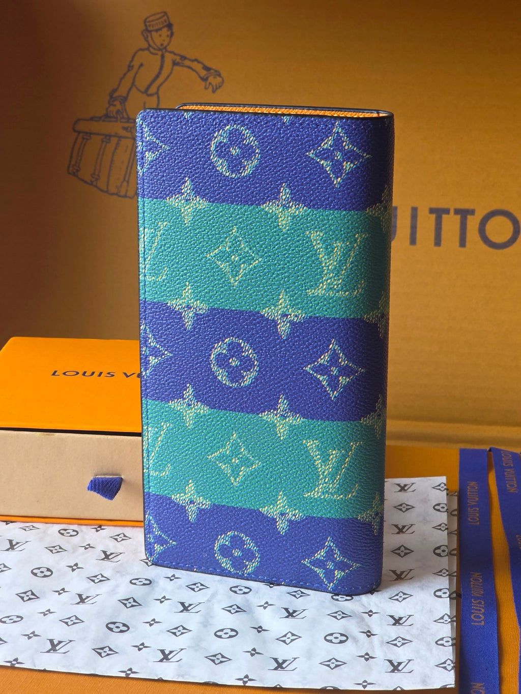 Small card holder standing front view with blue-and-teal monogram print