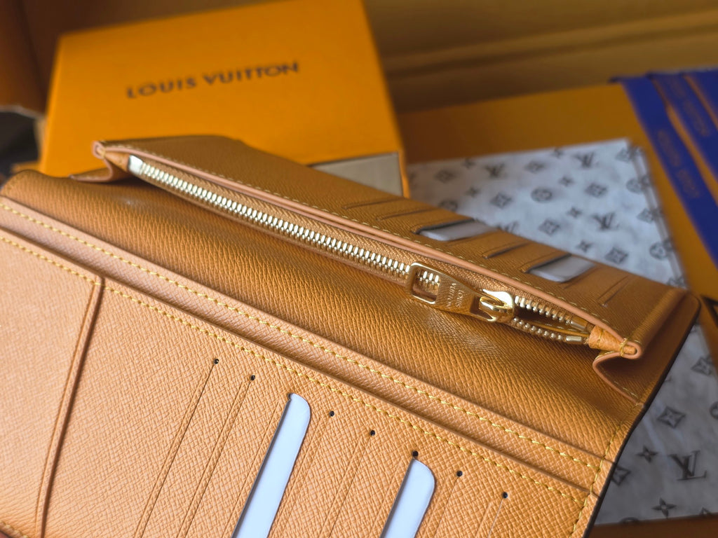 Small card holder exterior with gold zipper and pale blue card slots