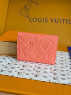 Louis Vuitton small pink bag with embossed monogram pattern and front flap