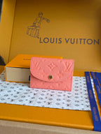 Louis Vuitton small pink textured leather bag with flap and gold snap closure