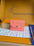 Louis Vuitton pink leather wallet with snap flap, embossed monogram pattern