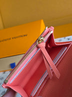 Louis Vuitton pink leather wallet interior view with zipper and card slots