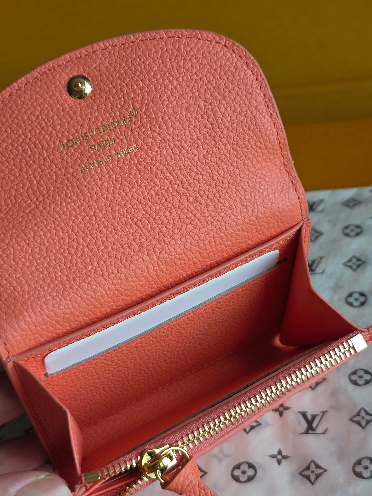 Louis Vuitton pink small bag interior with zip opening and embossed leather lining