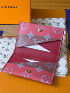 Small Louis Vuitton bag with two pink compartments and blue monogram, clasp hardware visible