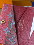 Small Louis Vuitton bag interior close-up with gold Louis Vuitton stamp on pink lining