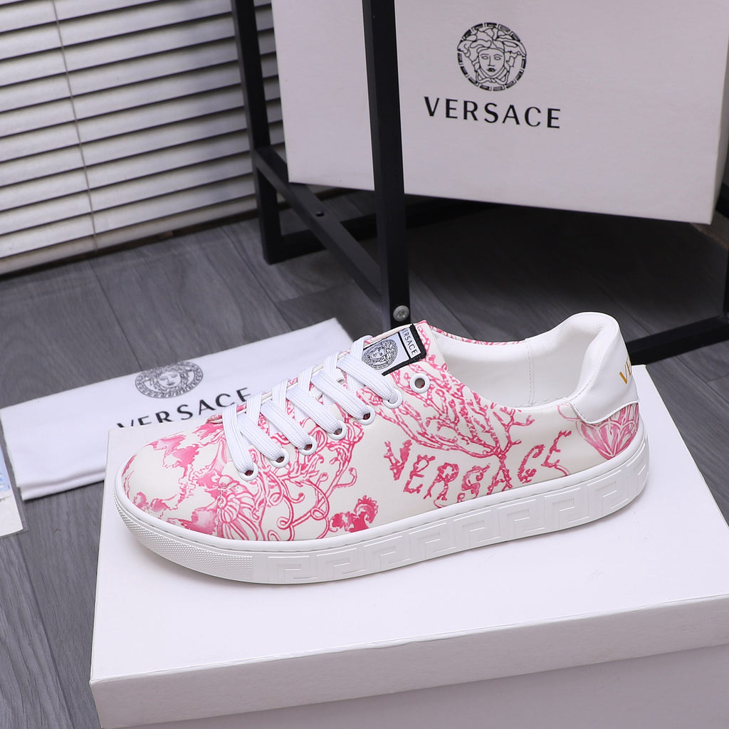 Pink and white patterned low-profile sneakers with white laces and grippy sole