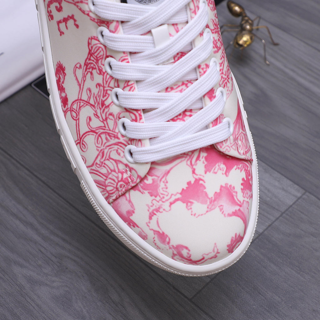 Close-up of pink patterned sneaker toe with white laces and white rubber edge
