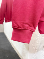 Pink sweatshirt sleeve cuff and hem, ribbed knit detail