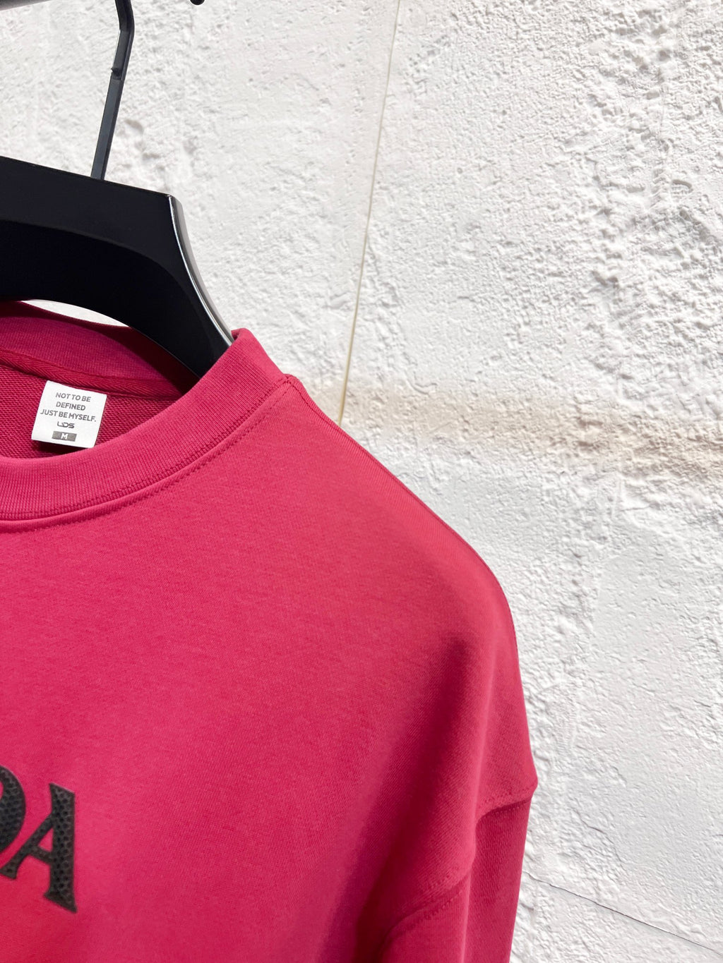 Pink long-sleeve sweatshirt with partial PRADA logo on chest