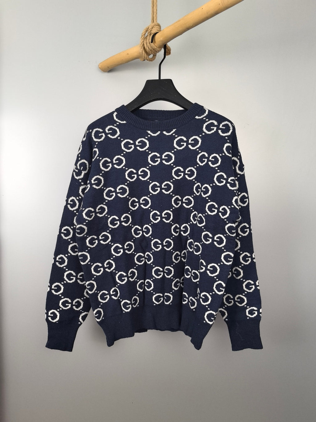 Navy knitted sweater with repeating GG logo pattern, crew neck and long sleeves