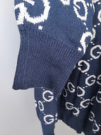 Navy ribbed knit sweater hem and sleeve with GG logo pattern