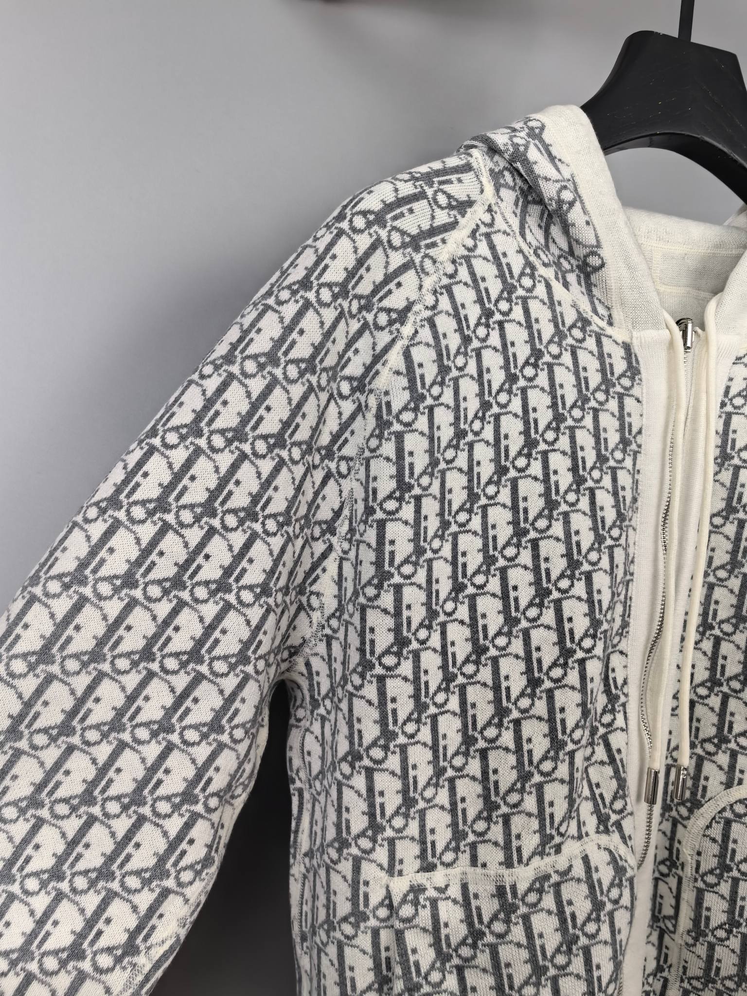 All-over monogram zip-up hoodie with hood and off-white trim, side view