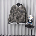 Long-sleeve jacket in dark gray with button front and black-and-white striped cuffs