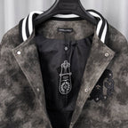 Long-sleeve jacket inside view with black inner panels and embroidered crest detail