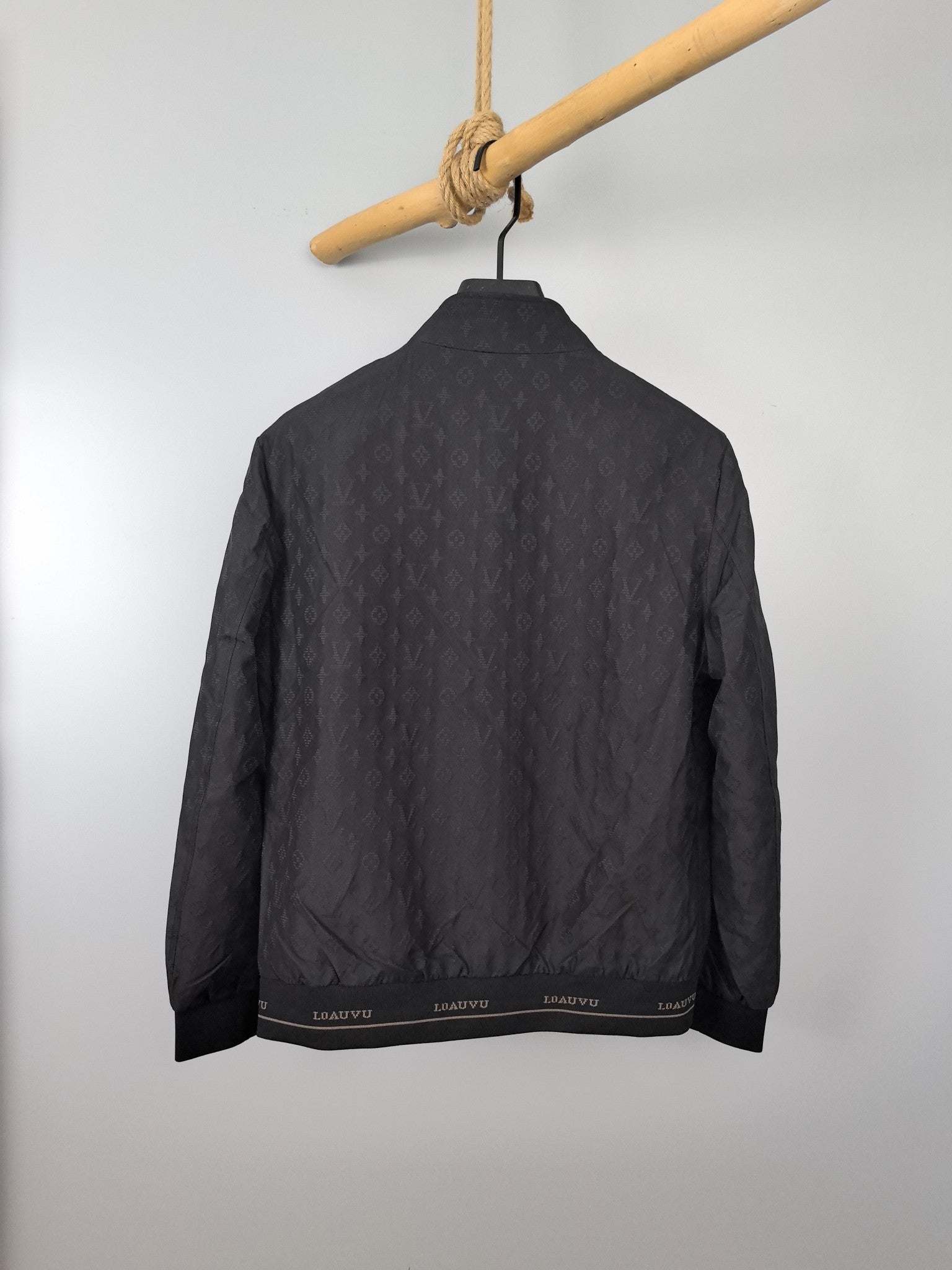 Louis Vuitton monogram bomber jacket, dark gray back view with ribbed bottom hem