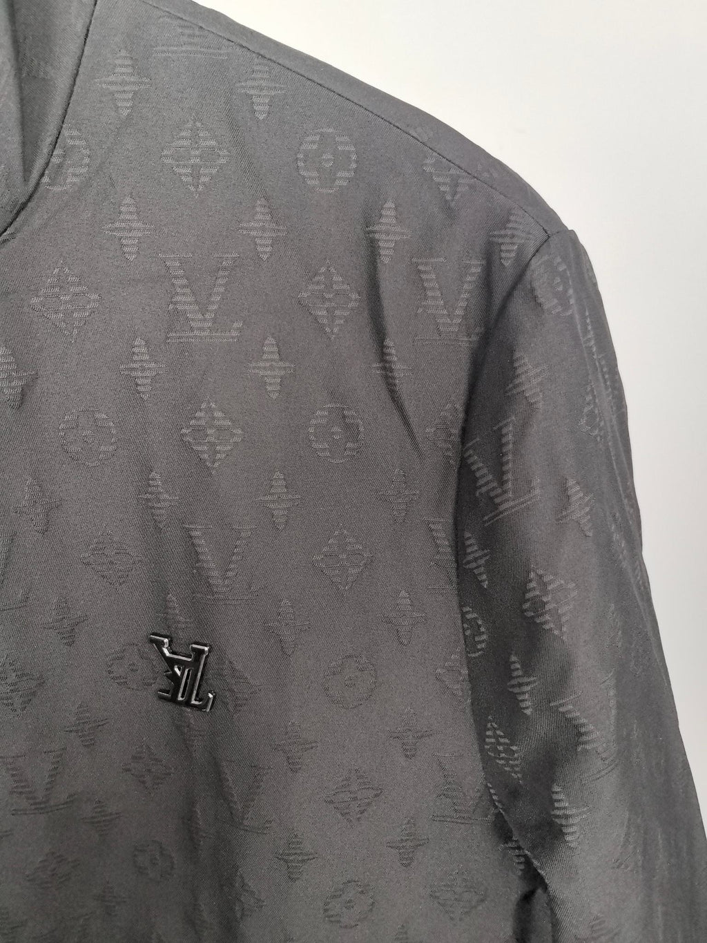 Louis Vuitton monogram zip jacket sleeve with small LV logo detail