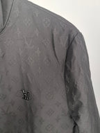Louis Vuitton monogram zip jacket sleeve with small LV logo detail