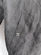 Louis Vuitton monogram zip jacket pocket detail with snap and stitch seam