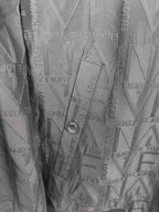 Dior long jacket interior lining close-up with embossed geometric pattern