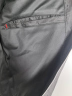 Dior long jacket lining close-up, inner seam and pocket opening detail