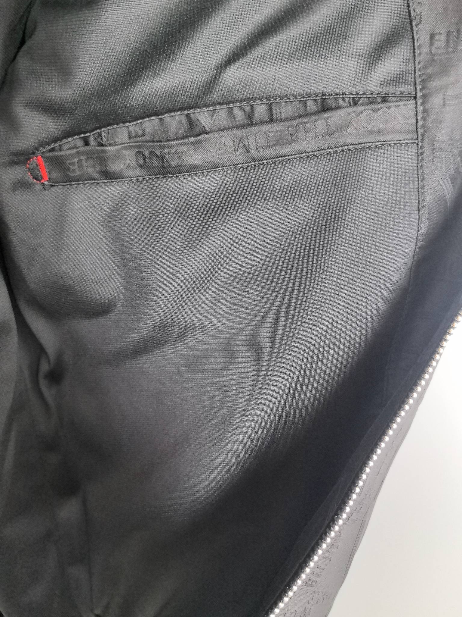Dior long jacket lining close-up, inner seam and pocket opening detail