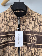Beige patterned long zip jacket with stand collar and central zipper, close-up
