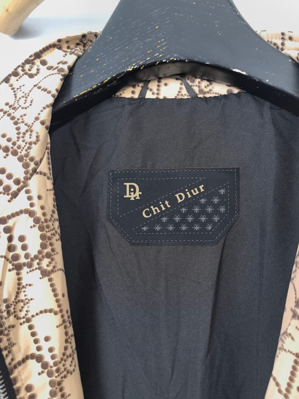 Dark interior lining with fabric label on long jacket, view from inside