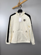 Moncler long hooded jacket in off-white with black side stripes and full zip front