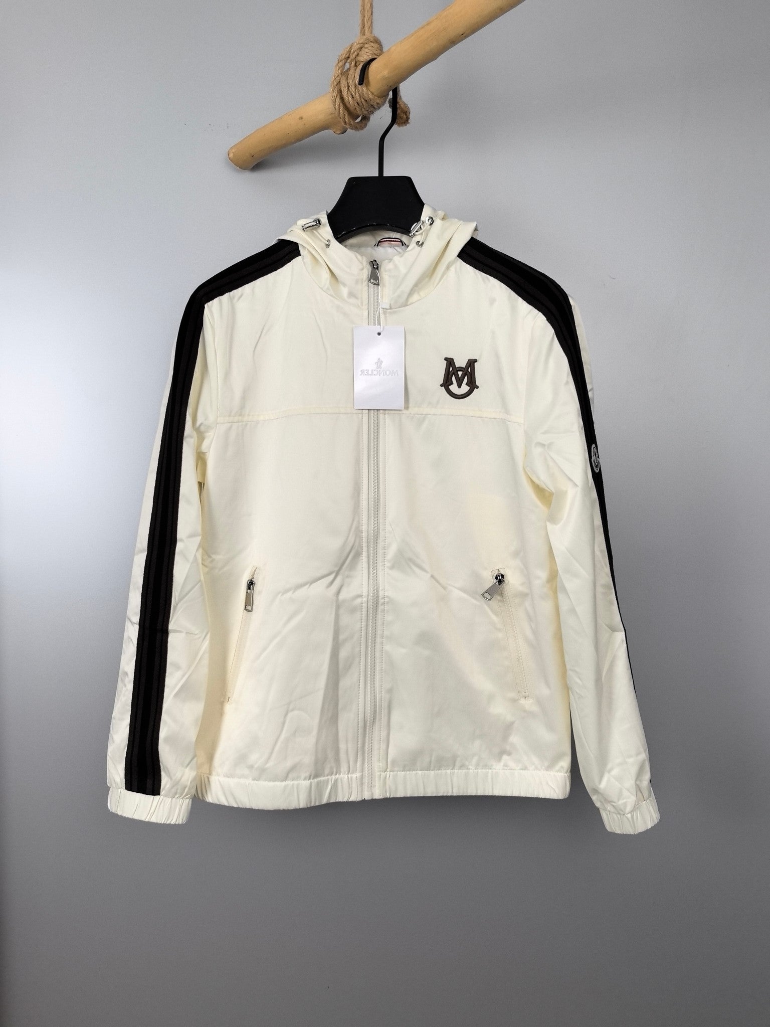 Moncler long hooded jacket in off-white with black side stripes and full zip front