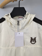 Moncler long hooded jacket in off-white with front zip and chest emblem