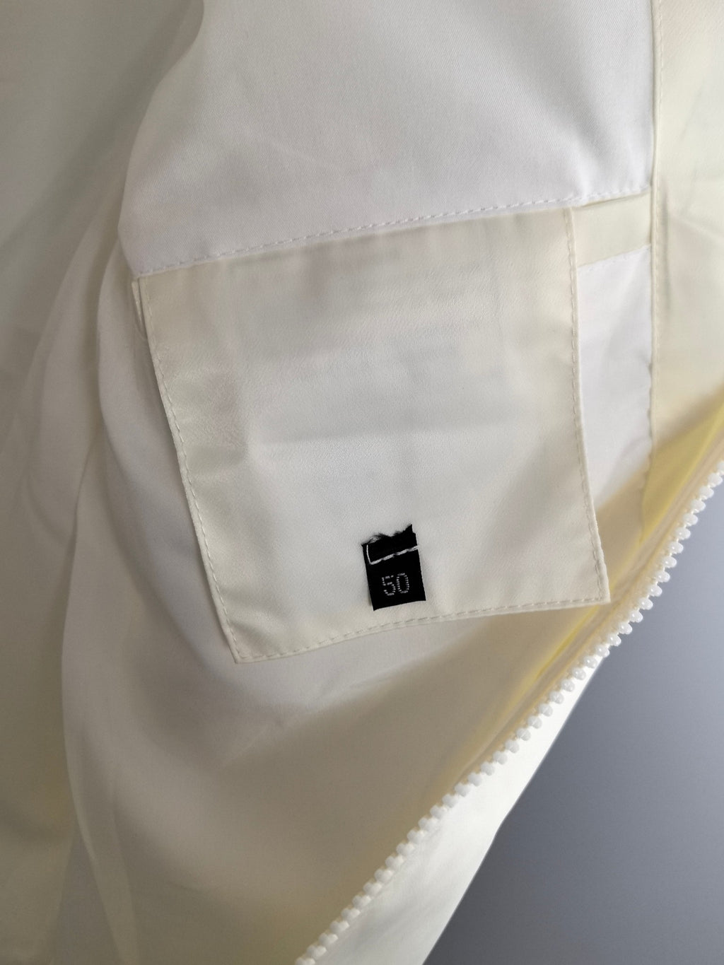 Moncler off-white long jacket with size tag on chest pocket panel