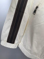 Moncler off-white long jacket sleeve with black striped band and zipper detail