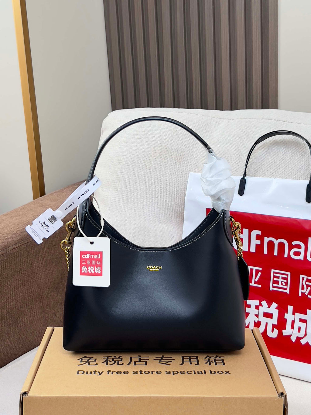 COACH navy leather hobo-style shoulder bag with short handles and chain strap
